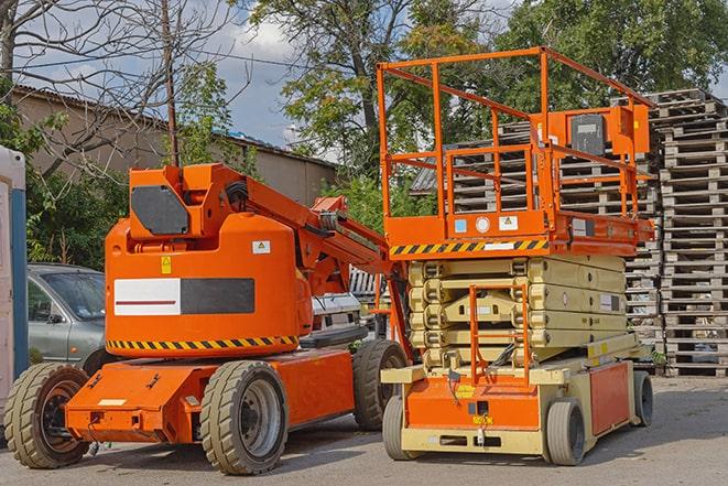 forklift carrying pallets in warehouse in Bellwood